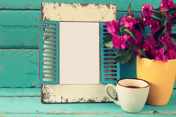 Vintage blank frame, cup of coffee next to beautiful purple mediterranean summer flowers. template, ready to put photography — 图库照片