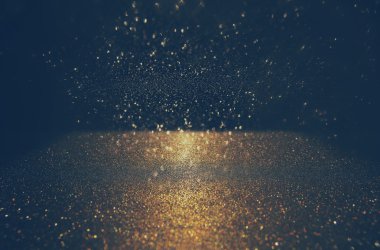 Glitter vintage ışıklar arka plan. altın rengi ve siyah. defocused.