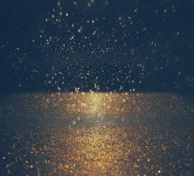 Glitter vintage ışıklar arka plan. altın rengi ve siyah. defocused.
