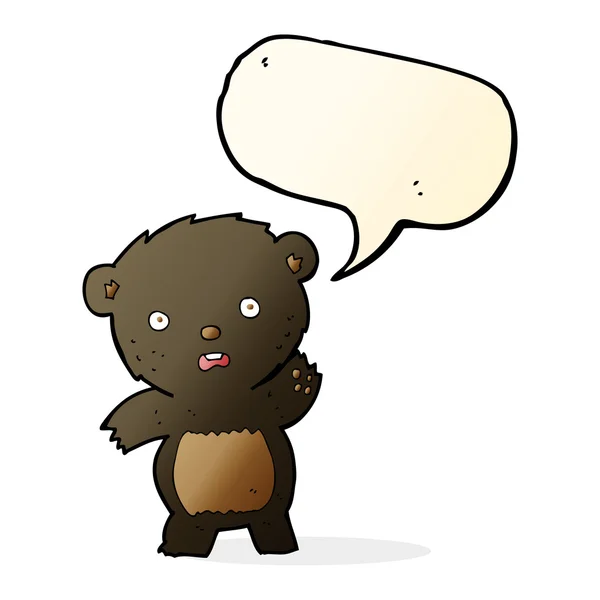 Cartoon waving black bear cub with speech bubble — Stock Vector