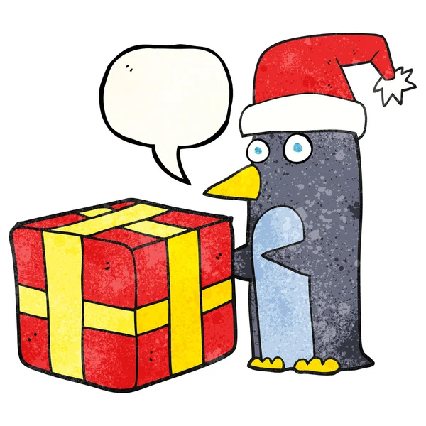 Discours bulle texturé dessin animé pingouin de Noël avec présent — Image vectorielle