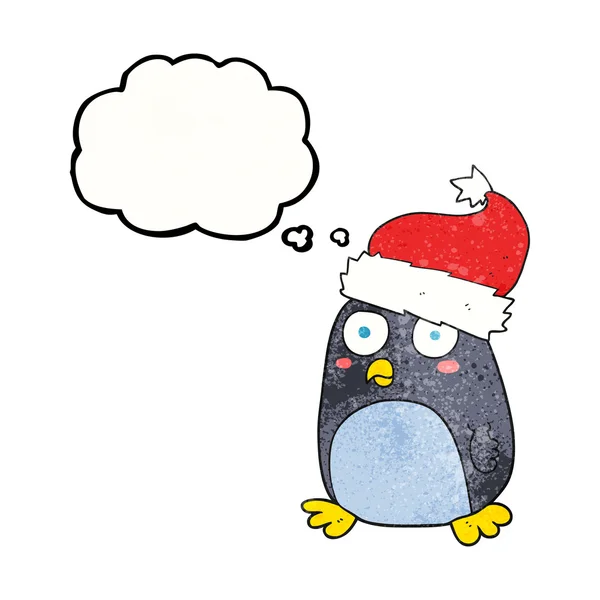 Thought bubble textured cartoon penguin in christmas hat — Stock Vector