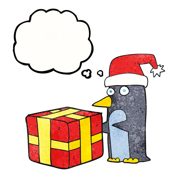 Bolla pensiero cartoni animati pinguino di Natale con presente — Vettoriale Stock