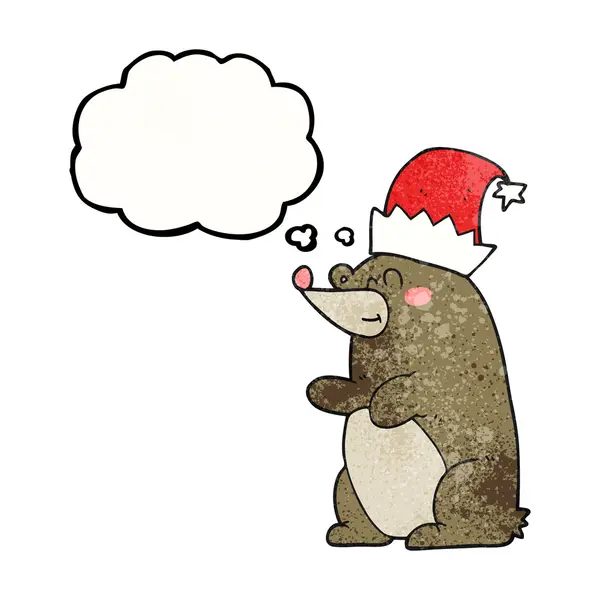 Pensée bulle texturé ours dessin animé portant chapeau de Noël — Image vectorielle