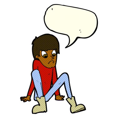 Çizgi filmci çocuk elinde konuşma balonuyla yerde oturuyor.