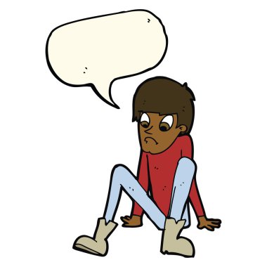 Çizgi filmci çocuk elinde konuşma balonuyla yerde oturuyor.