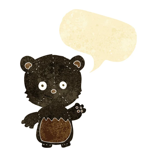 Cartoon black bearcub waving with speech bubble — Stock Vector