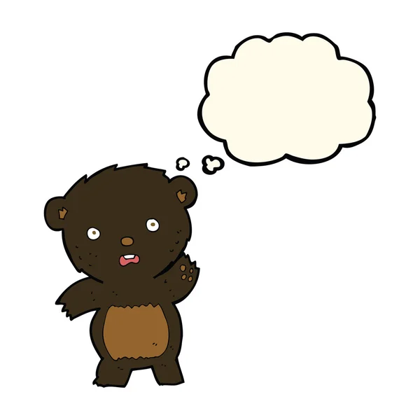 Desenho animado acenando filhote de urso preto com bolha pensamento — Vetor de Stock