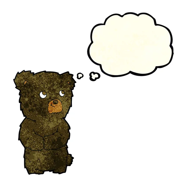Γελοιογραφία μαύρη αρκούδα cub με σκέψη φούσκα — Διανυσματικό Αρχείο