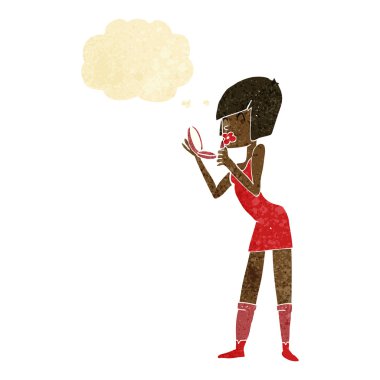 Düşünce baloncuğuyla ruj süren çizgi film kadını.