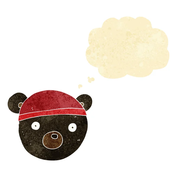 Desenho animado urso preto filhote usando chapéu com bolha pensamento — Vetor de Stock