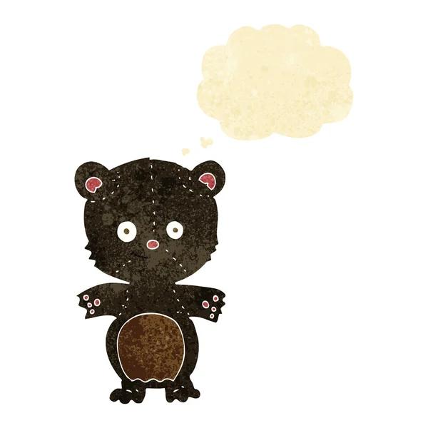 Cartoon black bear cub med tankebubbla — Stock vektor