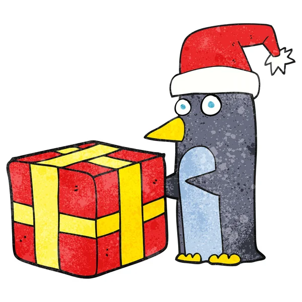Dessin animé texturé pingouin de Noël avec présent — Image vectorielle