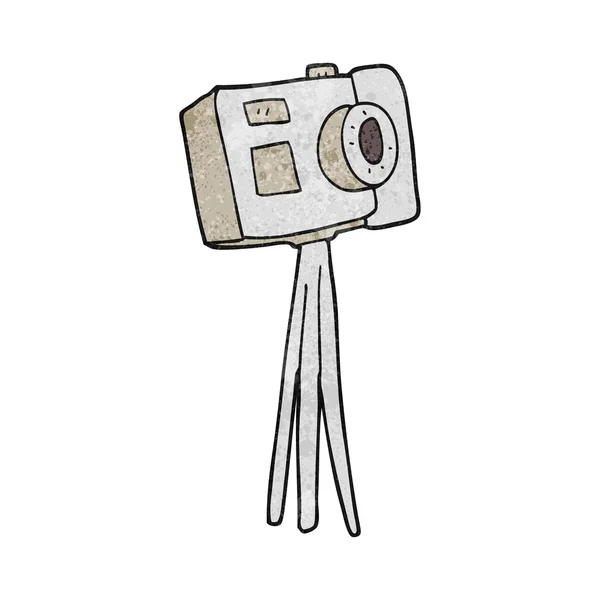 Getextureerde cartoon camera op statief — Stockvector