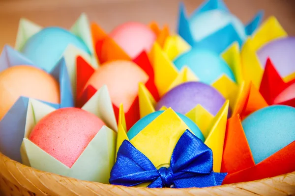 Easter colored eggs in colored wrapper — Stock Photo, Image