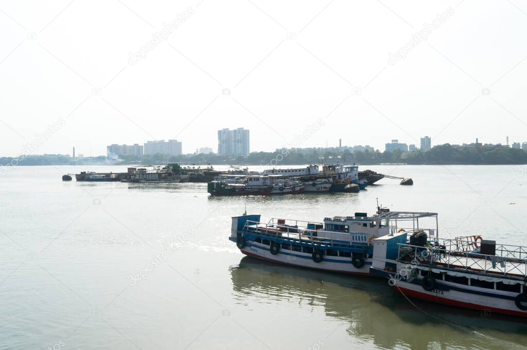 Ferry boats in Hooghly River on a sunny summer day. Kolkata (Calcutta), West Bengal, India South Asia pacific April 26, 2021