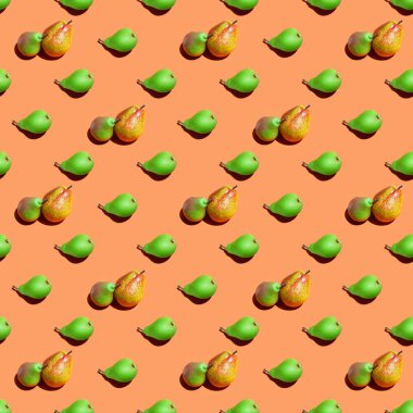 Armut deseni. Turuncu arka planda kusursuz taze armut deseni. Turuncu yüzeyde taze olgun organik armutlar izole edilmiş. Vejetaryen, vejetaryen sağlıklı yiyecekler. Diyet organik ürün.
