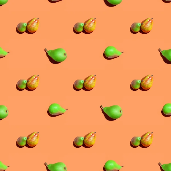 Pears pattern. Fruit seamless pattern of fresh pears on an orange background. Fresh ripe organic pears isolated on orange surface. Vegan, vegetarian healthy food. Diet organic product.