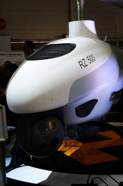 Strike unmanned aerial vehicle. Helicopter-type UAV with STEALTH technology at the international exhibition ARMS AND SECURITY - 2021. Selective focus. Kiev. Ukraine - June 18, 2021.