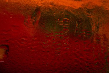 Wet color texture. Abstract macro texture with gradient. Dark background. Selective soft focus