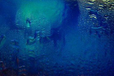 Colorful abstract texture. Wet macro texture with a color gradient. Abstract background with drops. Selective soft focus