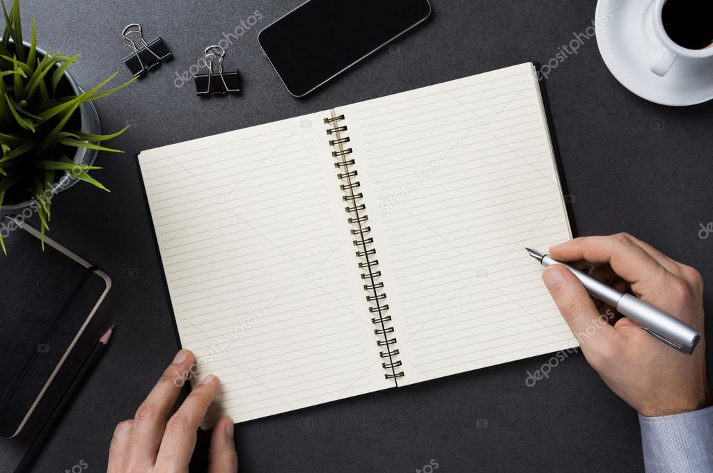 Businessman writing note