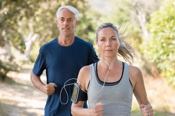 Senior couple jogging — Stock Photo, Image