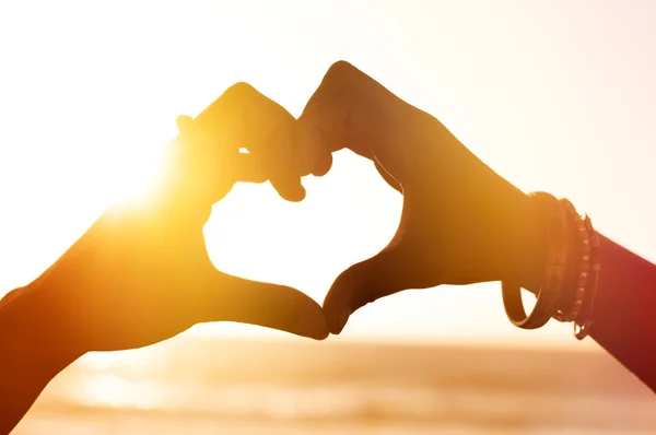 Loving hands at sunset — Stock Photo, Image