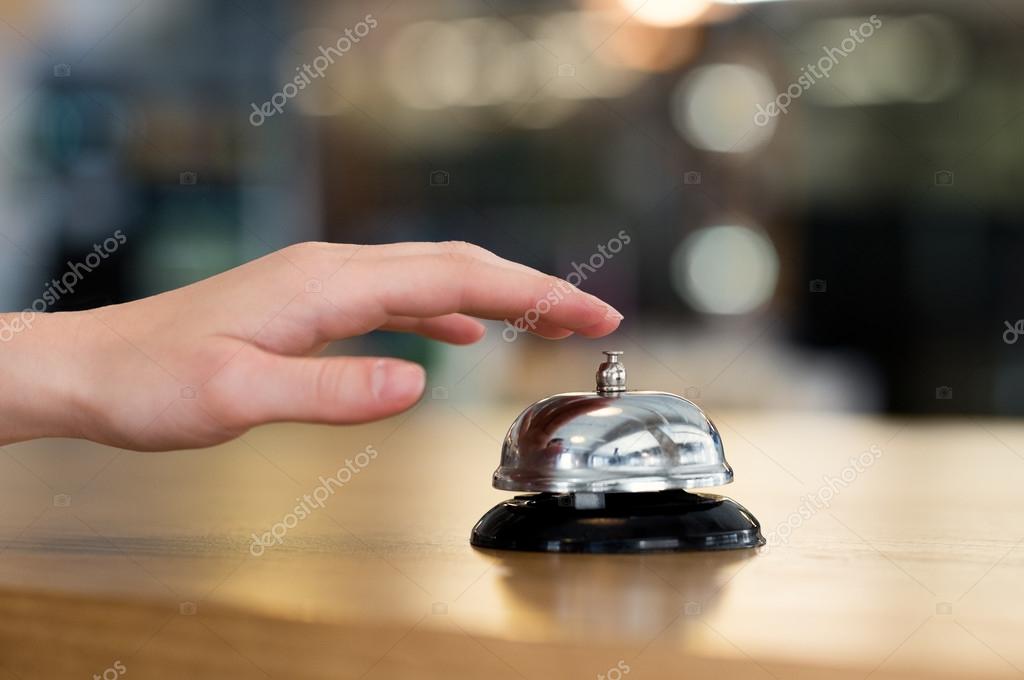 Hand ring bell at hotel — Stock Photo © ridofranz #115813586