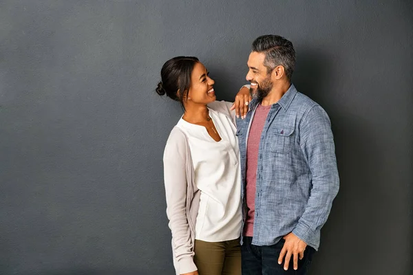 Happy Mature Indian Couple Embracing Looking Each Other Gray Background — Stock Photo, Image