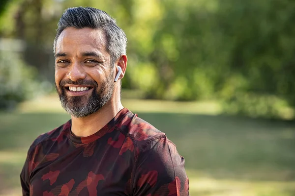 Mature Fitness Man Listening Music While Resting Jogging Happy Middle — Stock Photo, Image