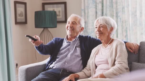 Happy Senior Couple Living Room Using Remote Control Change Channel — Stock Video