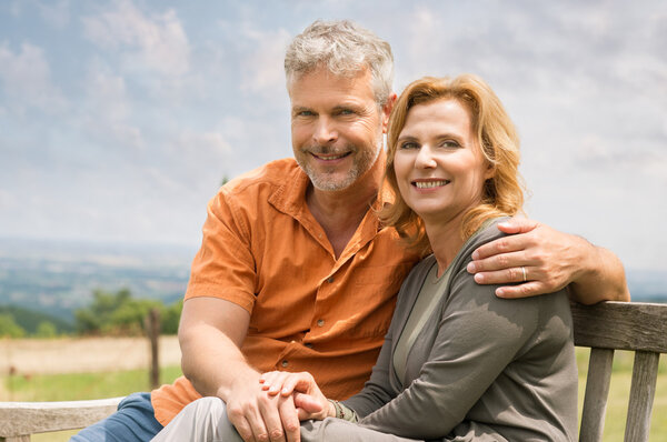 Couple Sitting On Bench