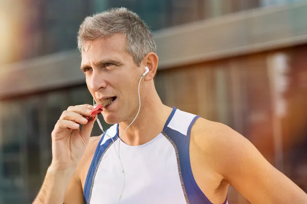 Fitness Man Eating Snack Food