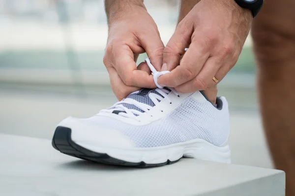 Runner Man Lacing Shoes — Stock Photo, Image