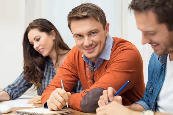 Smiling businessman at office — Stock Photo, Image