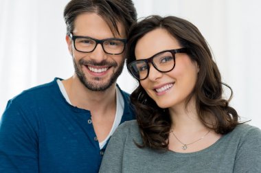 Smiling happy couple in spectacles