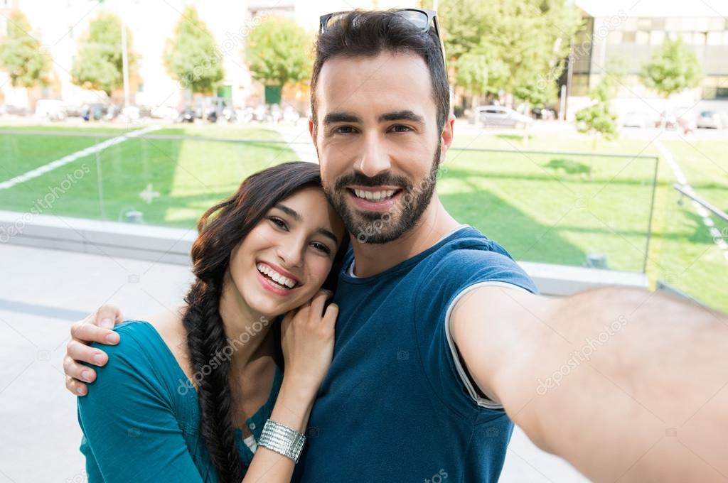 Young couple taking selfie