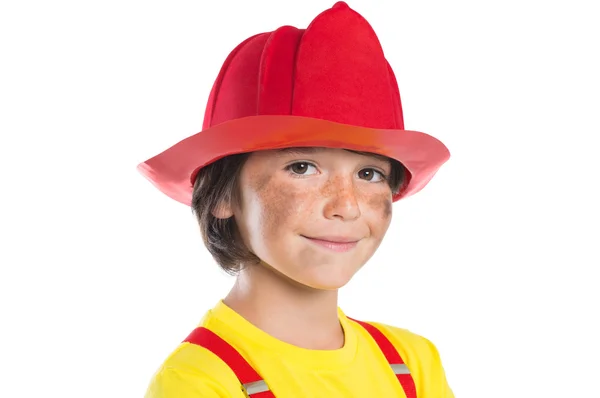 Unga brandman pojke ler — Stockfoto