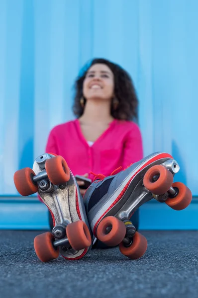 Young woman with rollerskates — Zdjęcie stockowe