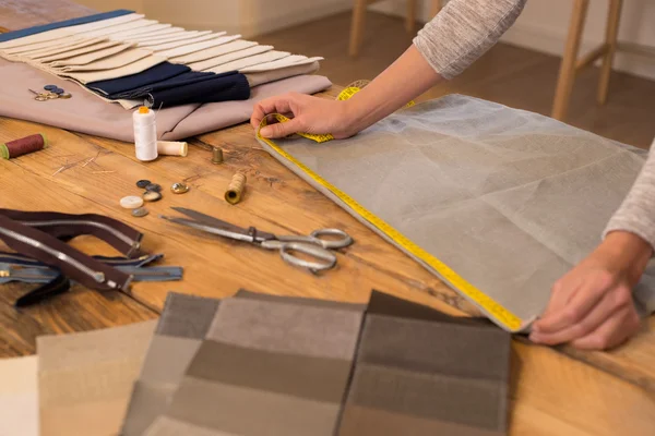 Fashion designer measuring cloth — 스톡 사진