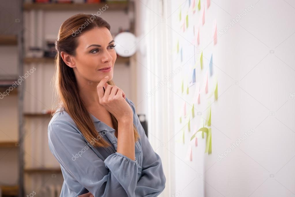 Woman looking business plan
