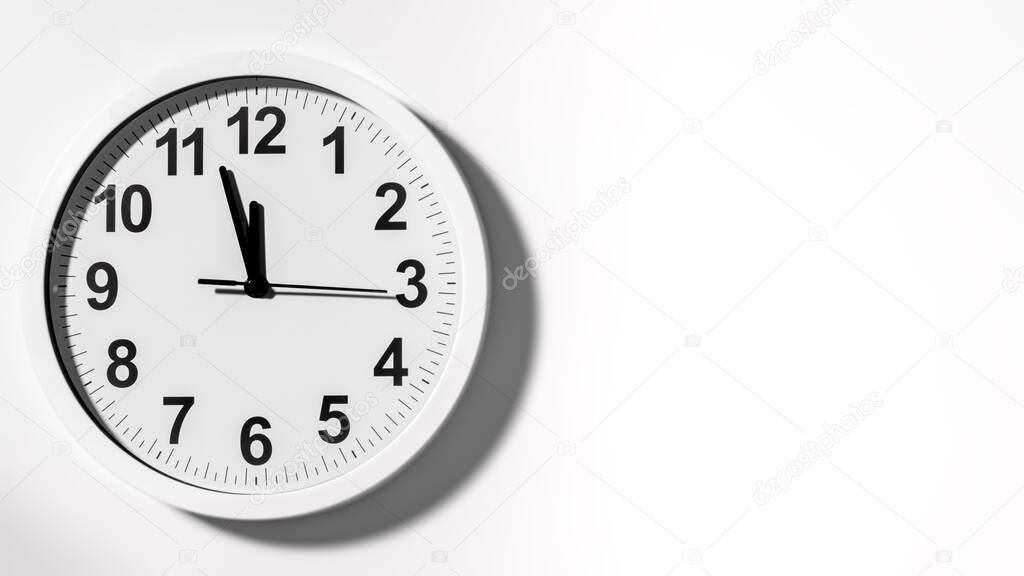 It is five to twelve, the clock is ticking. White Watch shows the time 5 before 12. Close up to a wall clock, with five minutes to twelve o'clock. Time is running out. White background with copy space