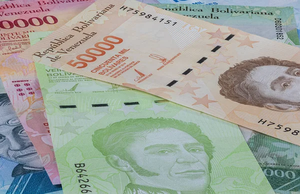 Bolivares or Bolivar money of the republic Venezuela. Close up to the currency of the south American country Venezuela. High inflation and weak economy increases the denomination of the banknotes.