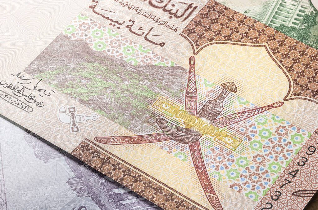 Close up to 100 Baisa of the Arabic country Oman. Paper banknotes of the Arabian country. Detailed capture of the reverse art design. Detailed money background wallpaper. Currency bank note