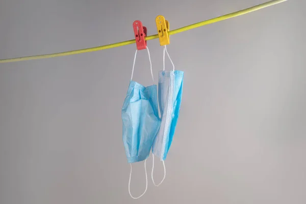 The last two face mask hanging on a rope. Face mask or Mouth mask are the most needed equipment during corona cov-19 crisis. No stock or sold out even though wearing a mask is mandatory in public