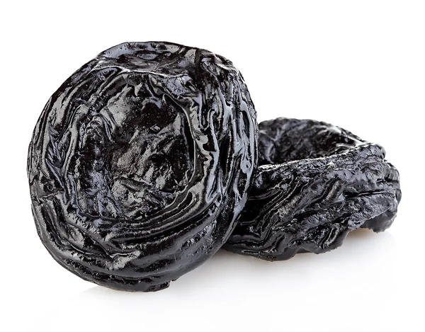 Raw organic prunes, dried plums, smoked prunes close-up on a white background. — Stock Photo, Image