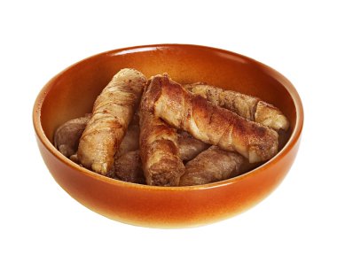 Sausages wrapped in bacon in a frying pan, chevapchichi on white background clipart