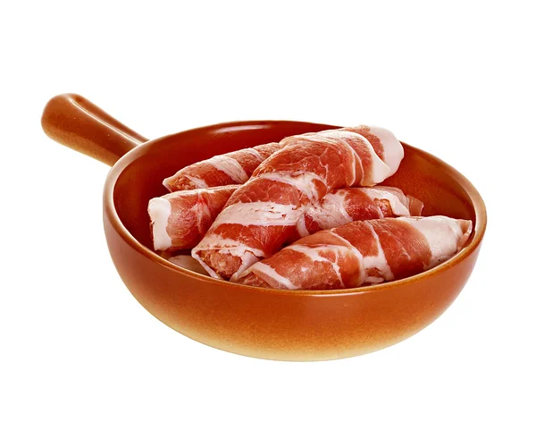 Sausages wrapped in bacon in a frying pan, chevapchichi on white background — Stock Photo, Image