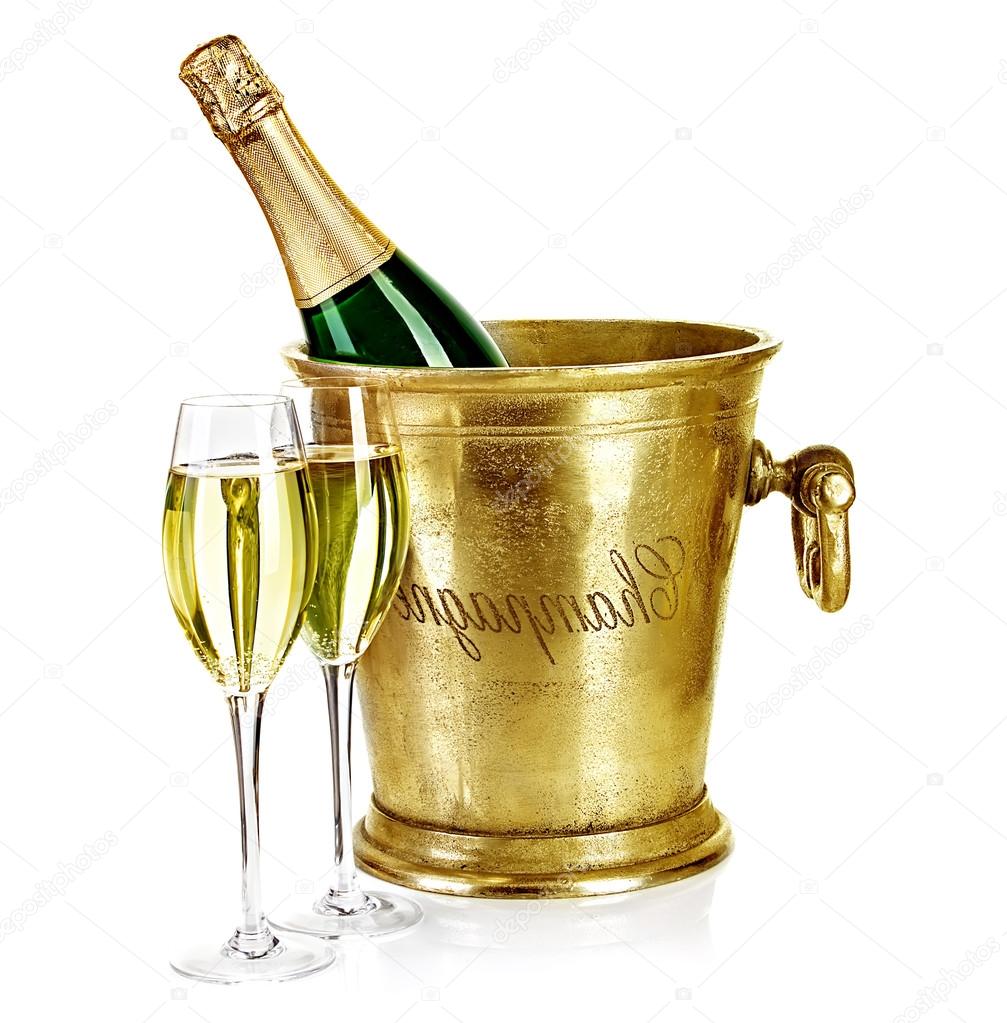 Bottle of champagne  in ice bucket with stemware isolated on whi